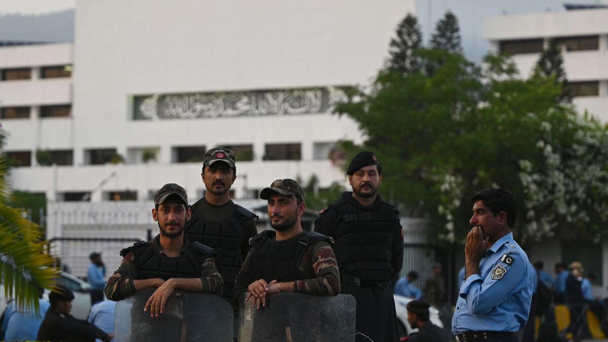 Security personnel stand guard in front of the National Assembly during the budget presentation session in Islamabad on June 9, 2023. -- AFP