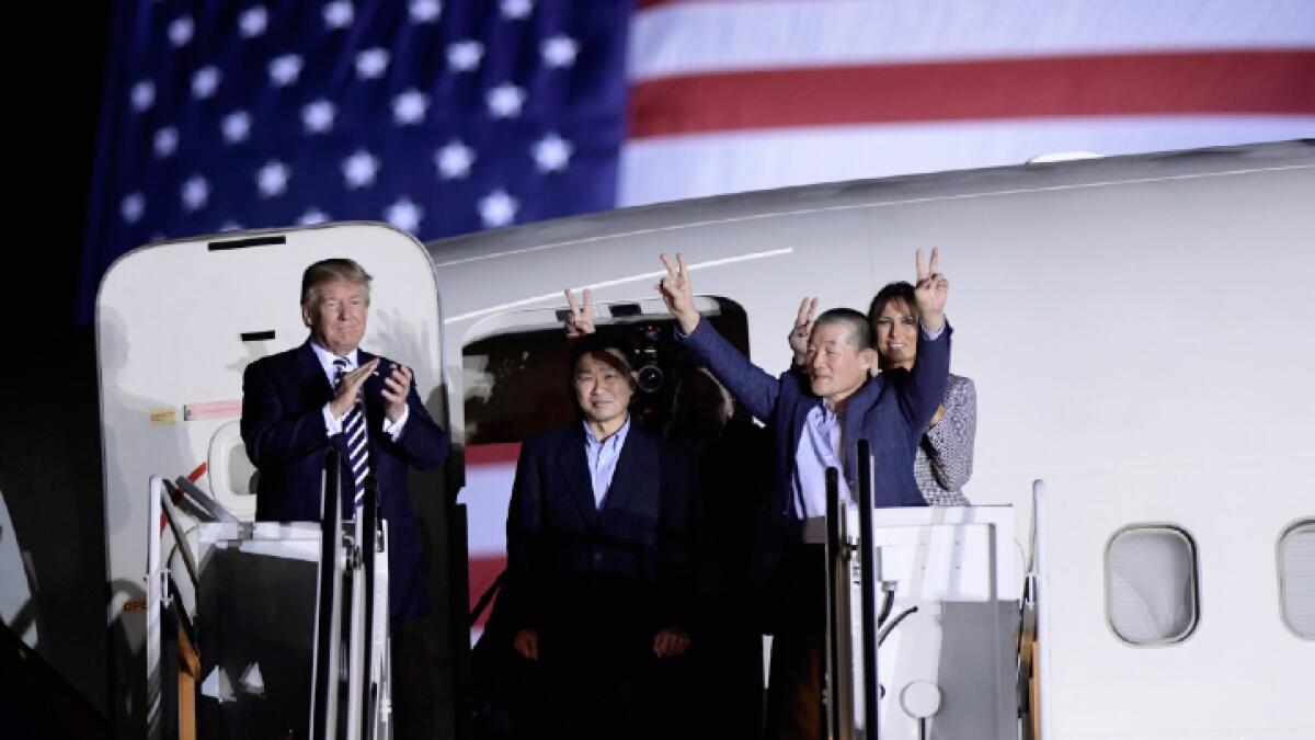 Trump gives freed Americans flag-waving, wee-hours welcome