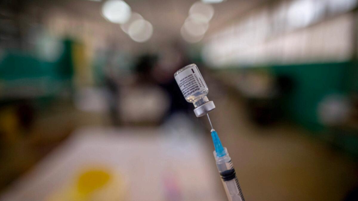 A health worker prepares a dose of the Pfizer vaccine. — AP