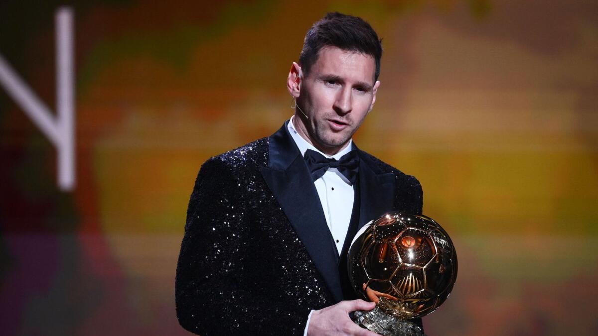 Paris Saint-Germain's Argentine forward Lionel Messi poses after being awarded the  Ballon d'Or in Paris. (AFP)