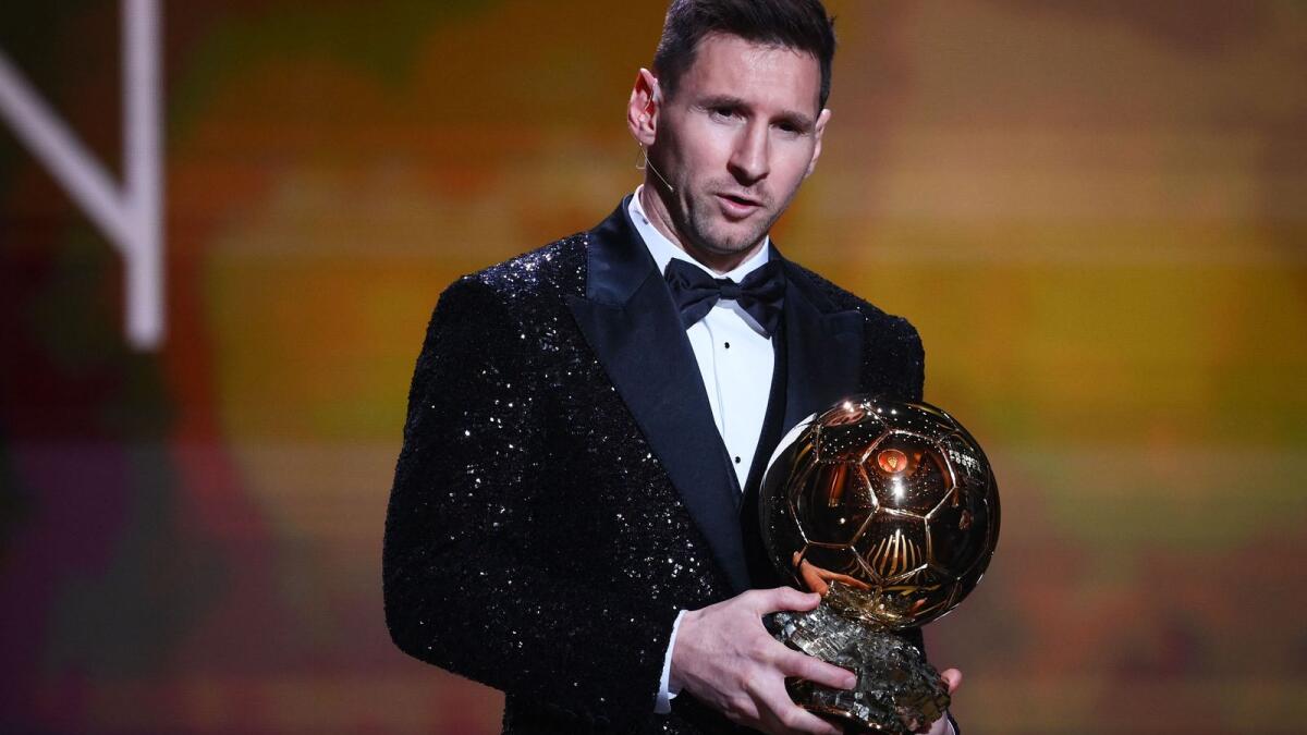 Lionel Messi poses after being awarded the the Ballon d'Or. (AFP)