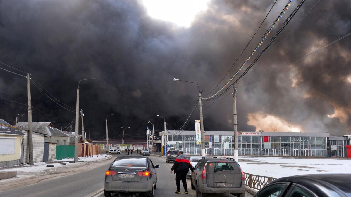 Black smoke rises into the sky from the Barabashovo market - one of the largest markets in the eastern Europe covering an area of more than 75 hectares -  which was reportedly hit by shelling, in Kharkiv on March 17, 2022, amid the ongoing Russia's attack of Ukraine. Photo: AFP