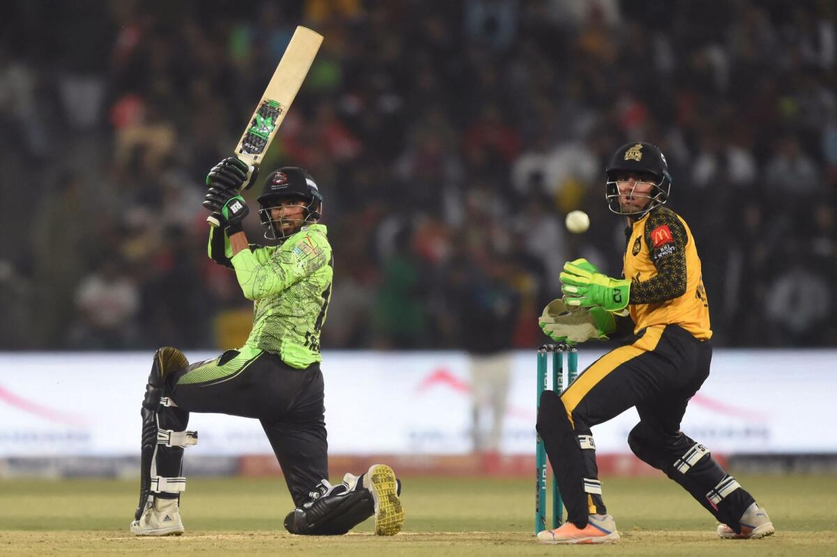 Lahore Qalandars' Mirza Baig (left) plays a shot during the Pakistan Super League (PSL) match against Peshawar Zalmi at the Gaddafi Cricket Stadium in Lahore on Friday. — AFP