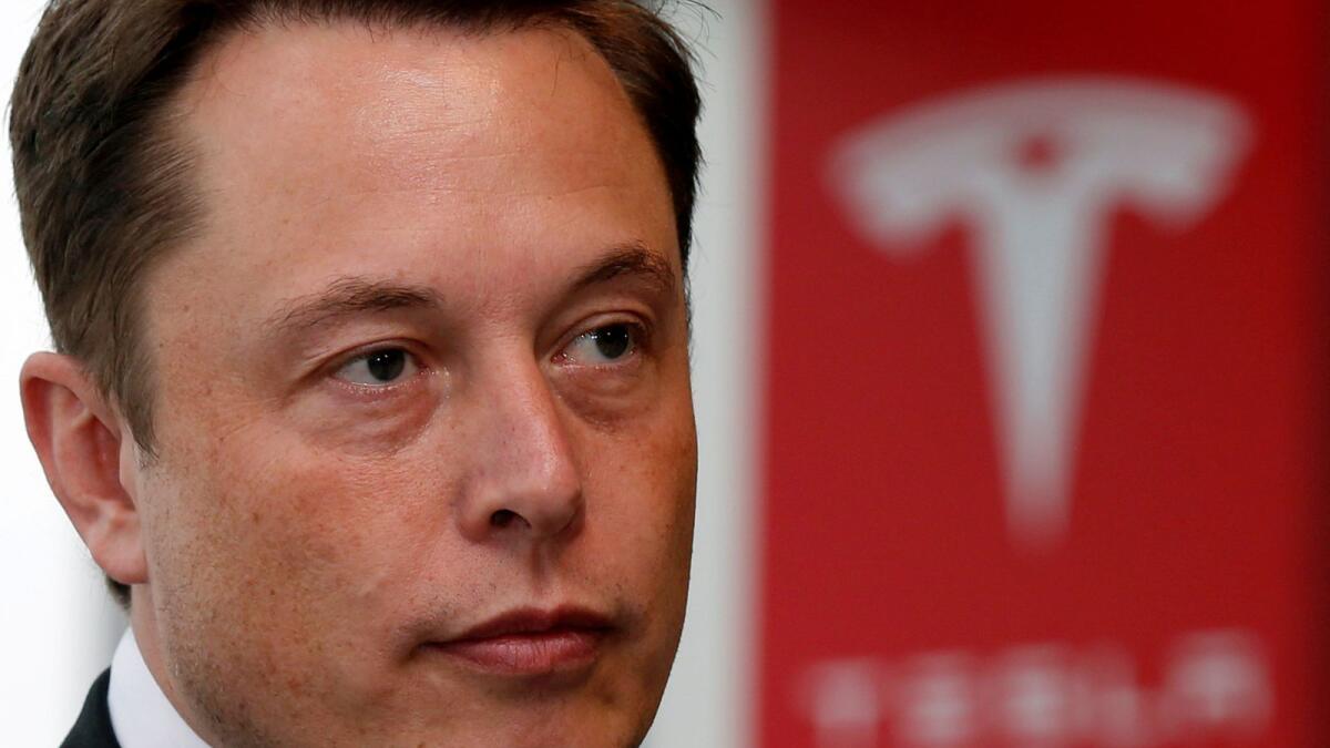 Tesla chief executive Elon Musk pauses during a news conference. Tesla currently offers a retail electric plan in Australia and the UK, focused on integrating home energy storage. — File photo