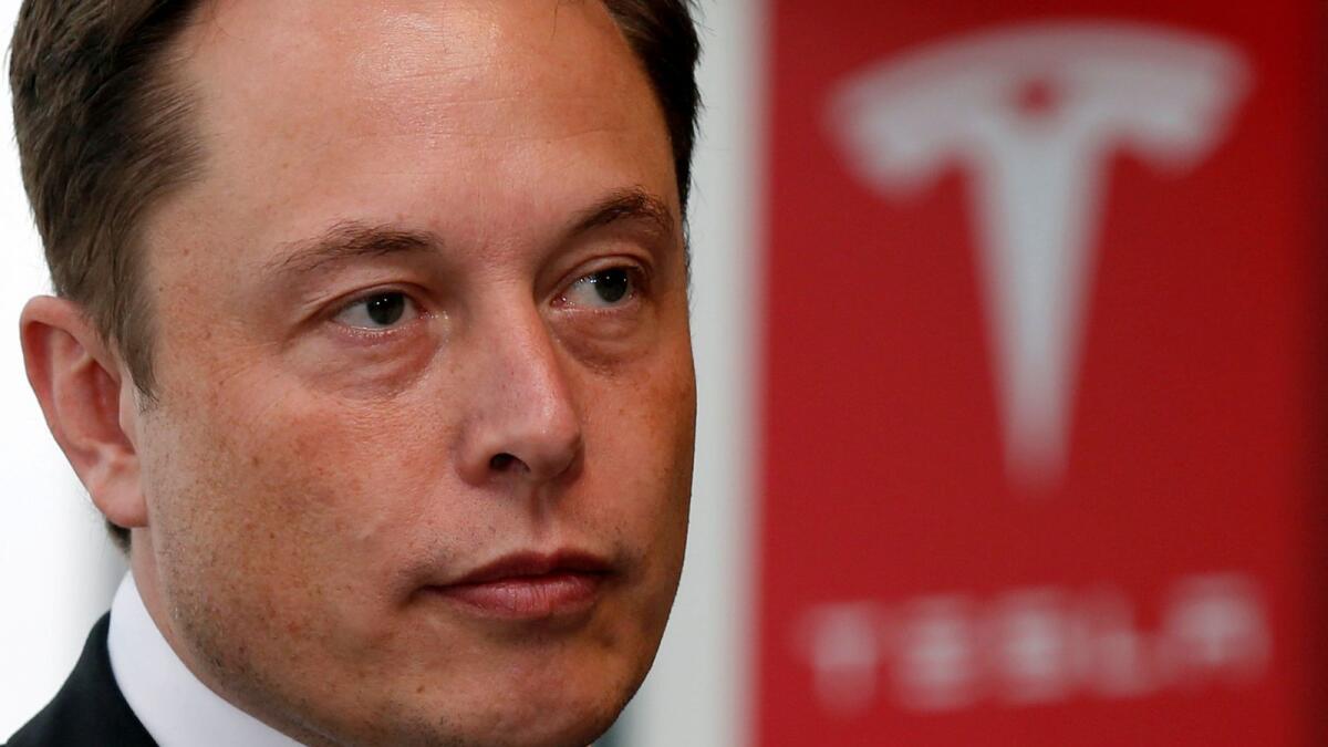 Tesla Motors chief executive Elon Musk pauses during a news conference. Musk has defended Tesla’s recent purchase of $1.5 billion of bitcoin, which has ignited mainstream interest in the digital currency — Reuters