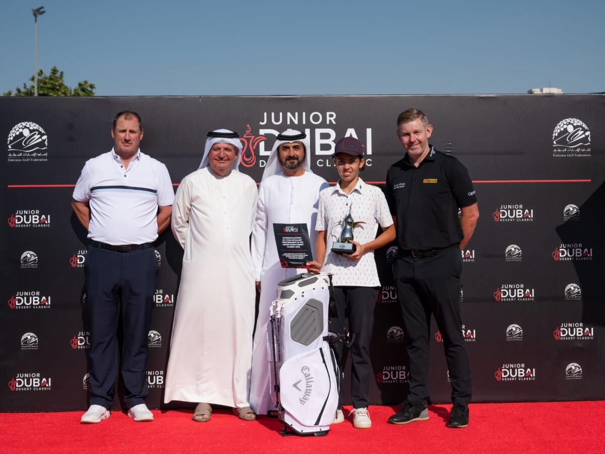 EGA officals with 13-year-old Anca Mateiu, leading girls player at the Junior Dubai Desert Classic. Photo: Supplied