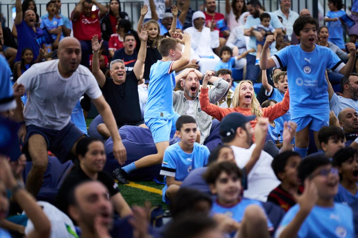 Fans in Abu Dhabi celebrate Manchester City’s first goal. — Supplied photo