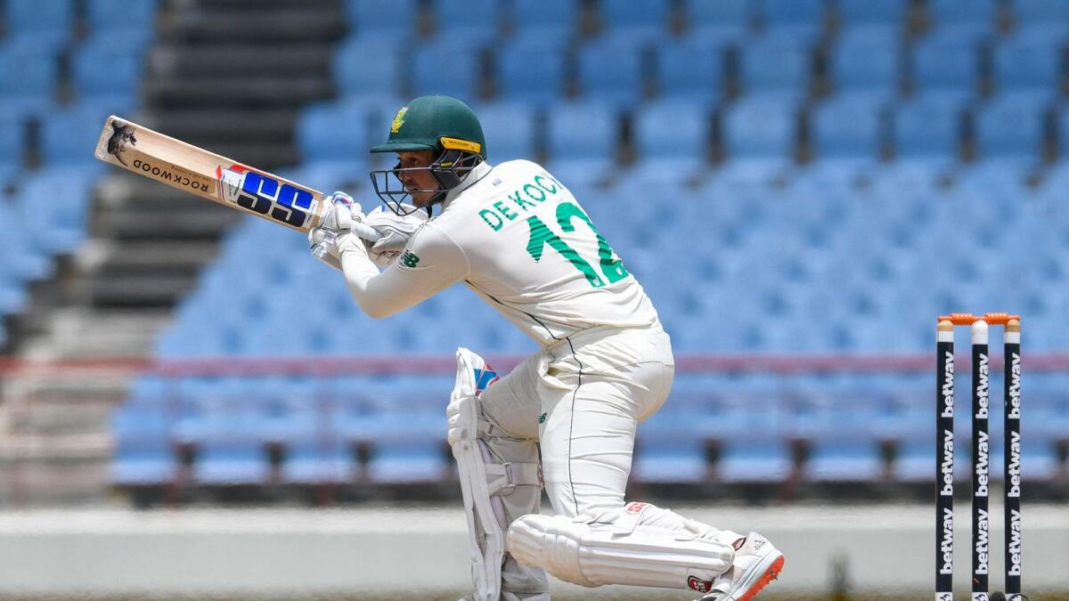 Quinton de Kock of South Africa hits a boundary during day 2 of the 2nd Test against West Indies. — AFP