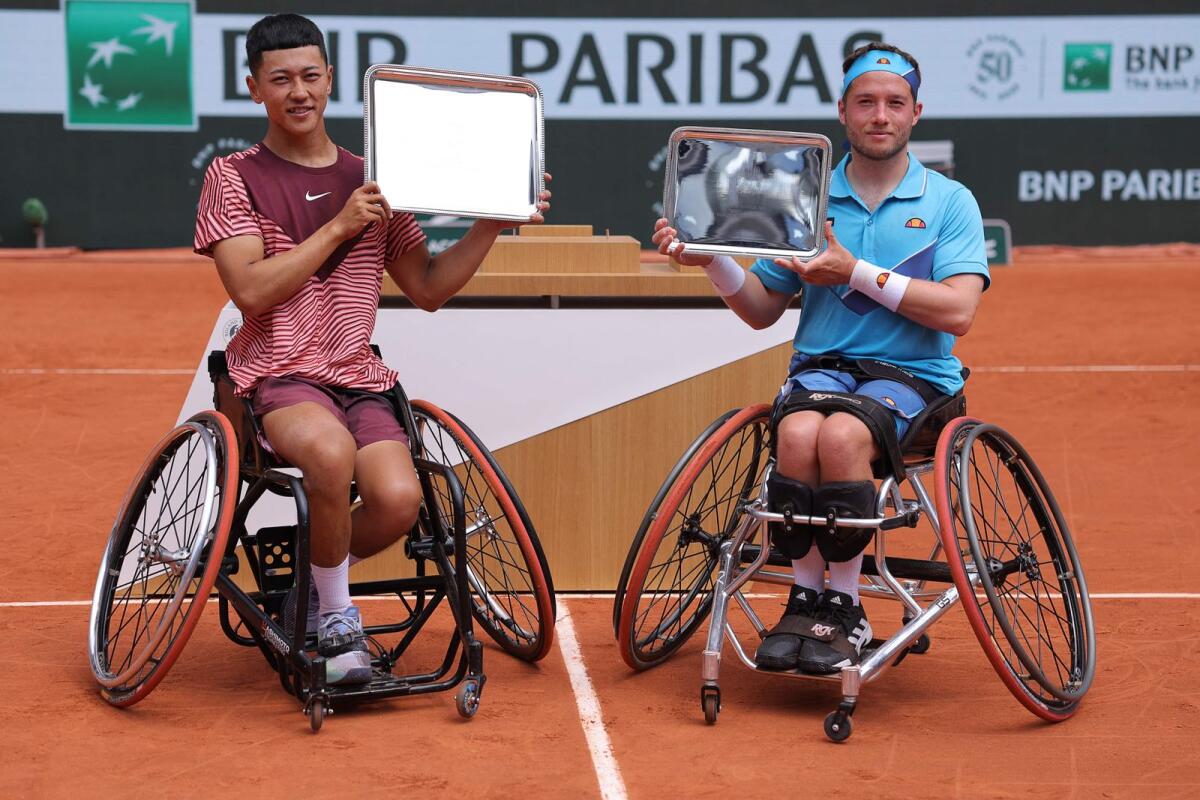 Japan's Tokito Oda (L) and Britain's Alfie Hewett pose with their trophies. - AFP