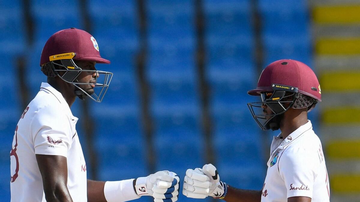 Jason Holder (left) and Kraigg Brathwaite of West Indies during day 4 of the 2nd Test against Sri Lanka. — AFP