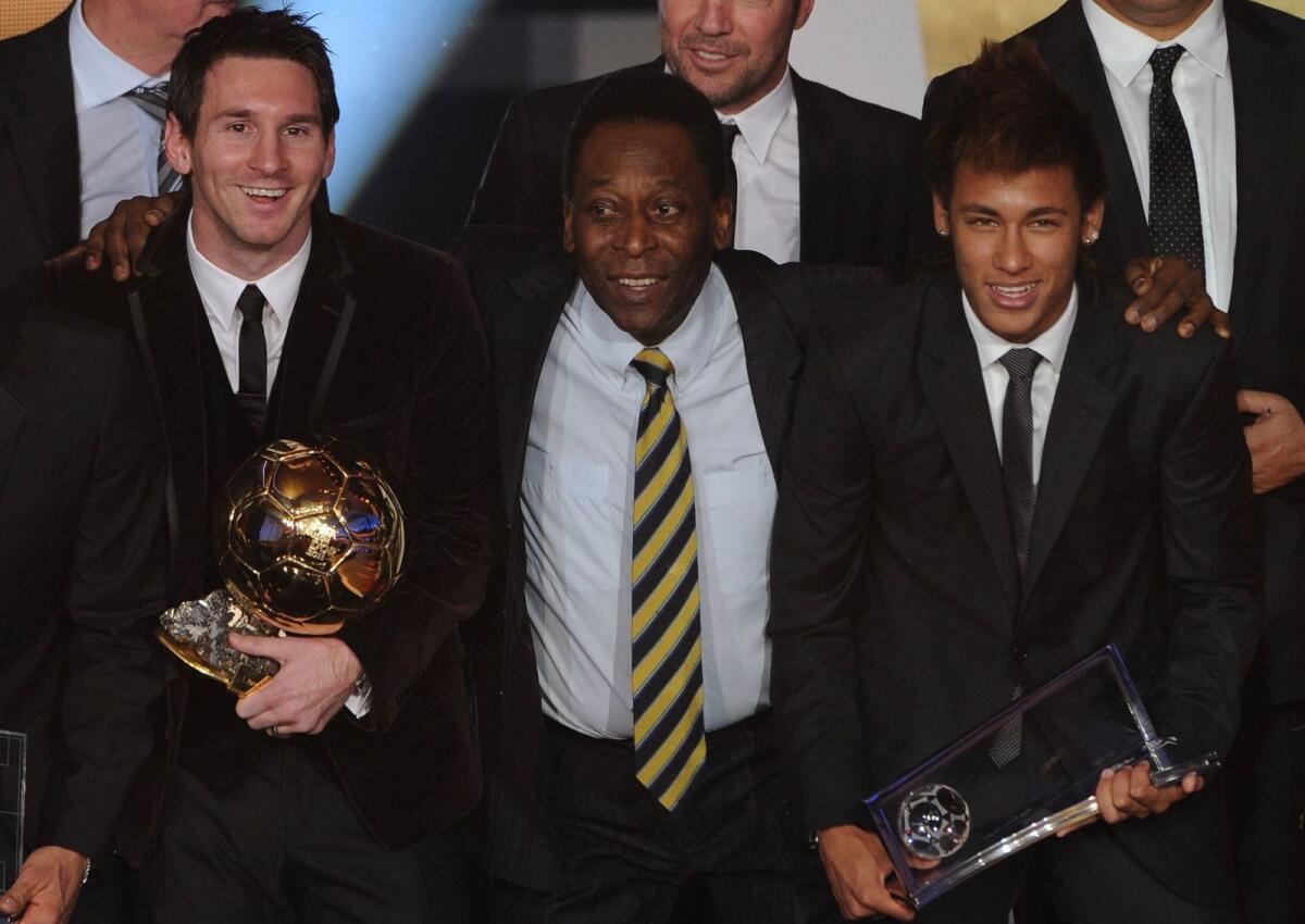 Lionel Messi (left) poses with Brazilian football legend Pele (centre) and Brazilian forward Neymar during the 2012 Fifa Ballon d'Or ceremony in Zurich. — AFP file