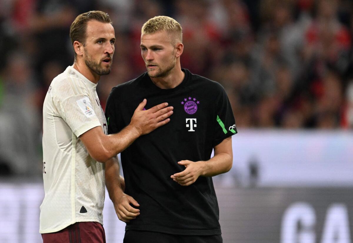Bayern Munich's English forward Harry Kane talks to his teammate Matthijs de Ligt after the match. — AFP