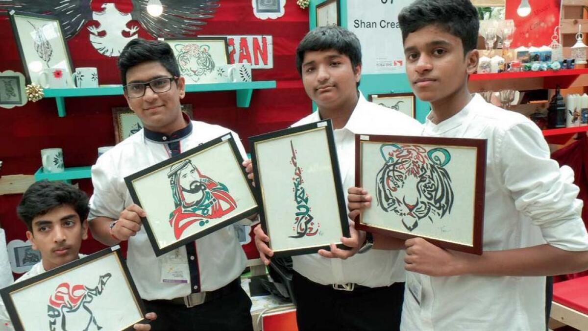 Hitesh, Shubhankar, Abhinav and Nazeel pose with the work designed using the Arabic alphabet. —KT photos by Shihab