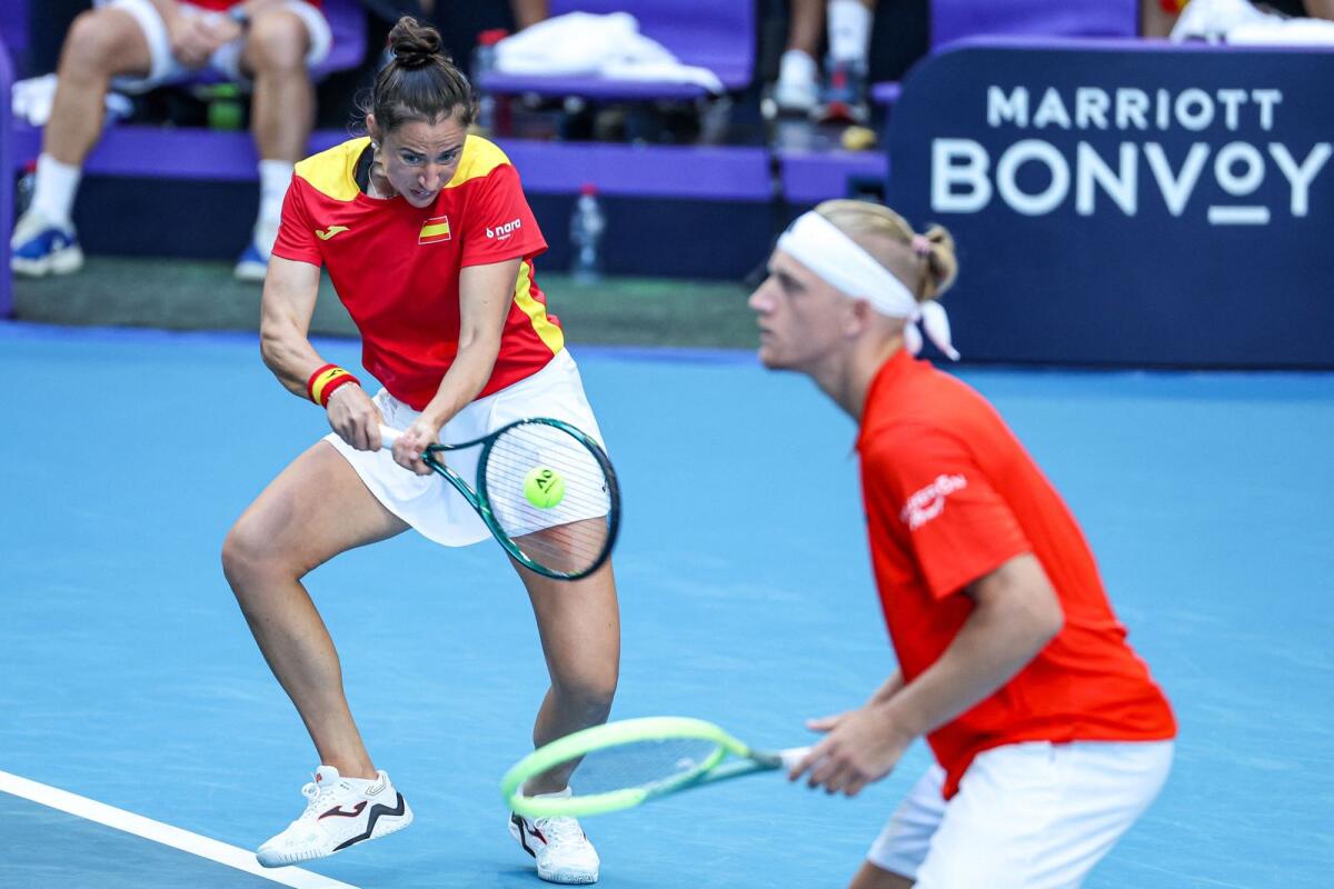 Spain's Sara Sorribes Tormo (L) and Alejandro Davidovich Fokina in action against Brazil's Beatriz Haddad Maia and Marcelo Melo. - AFP
