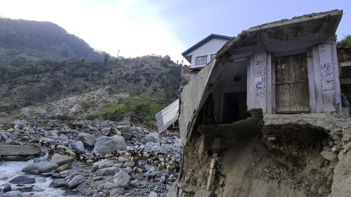 A home is seen destroyed by floodwaters in Kalam Valley in northern Pakistan. — AP