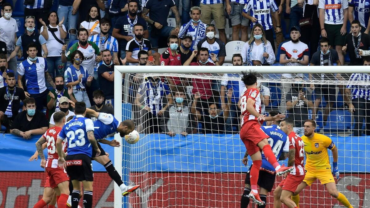 Alaves’ Victor Laguardia (third from left) heads home the winner against Atletico Madrid at the Mendizorroza Stadium in Vitoria, Spain on Saturday. — AP