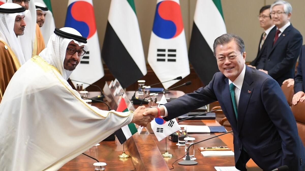 South Koreas President Moon Jae-in (R) shakes hands with Sheikh Mohamed bin Zayed Al Nahyan during a meeting at the presidential Blue House in Seoul.- AFP 