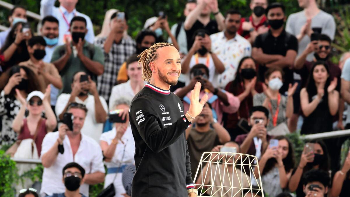 World champion at the world’s greatest show: Seven-time Formula One champion Lewis Hamilton waves to the crowd at Al Wasl Plaza at Expo 2020 Dubai on Monday. — AFP