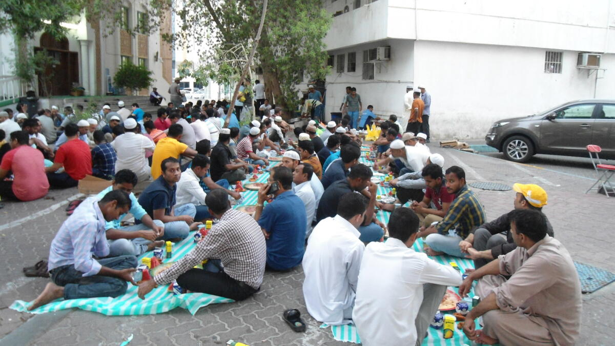 Devotees break their fast on the first day of the holy month of Ramadan in Abu Dhabi. - KT Photos by Syed Hameeduddin Quadri