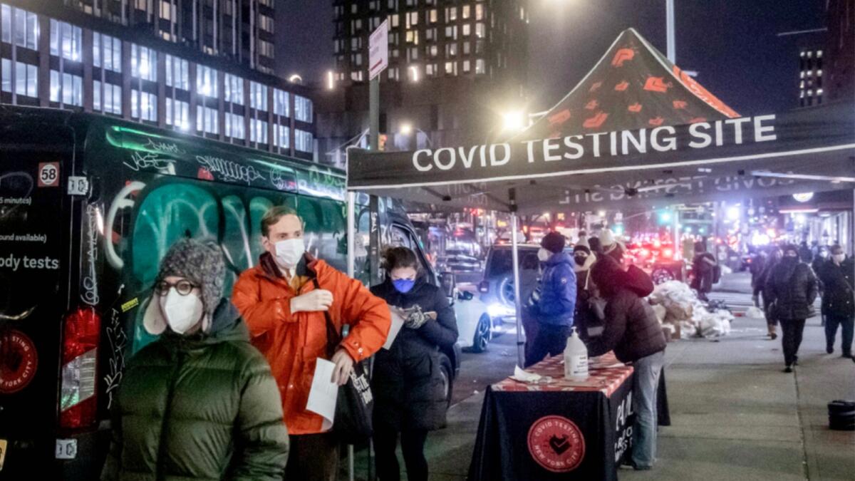 People wait on line to get tested for Covid-19 on the Lower East Side of Manhattan in New York. — AP
