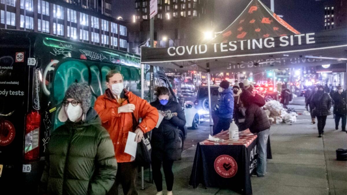People wait on line to get tested for Covid-19 on the Lower East Side of Manhattan in New York. — AP