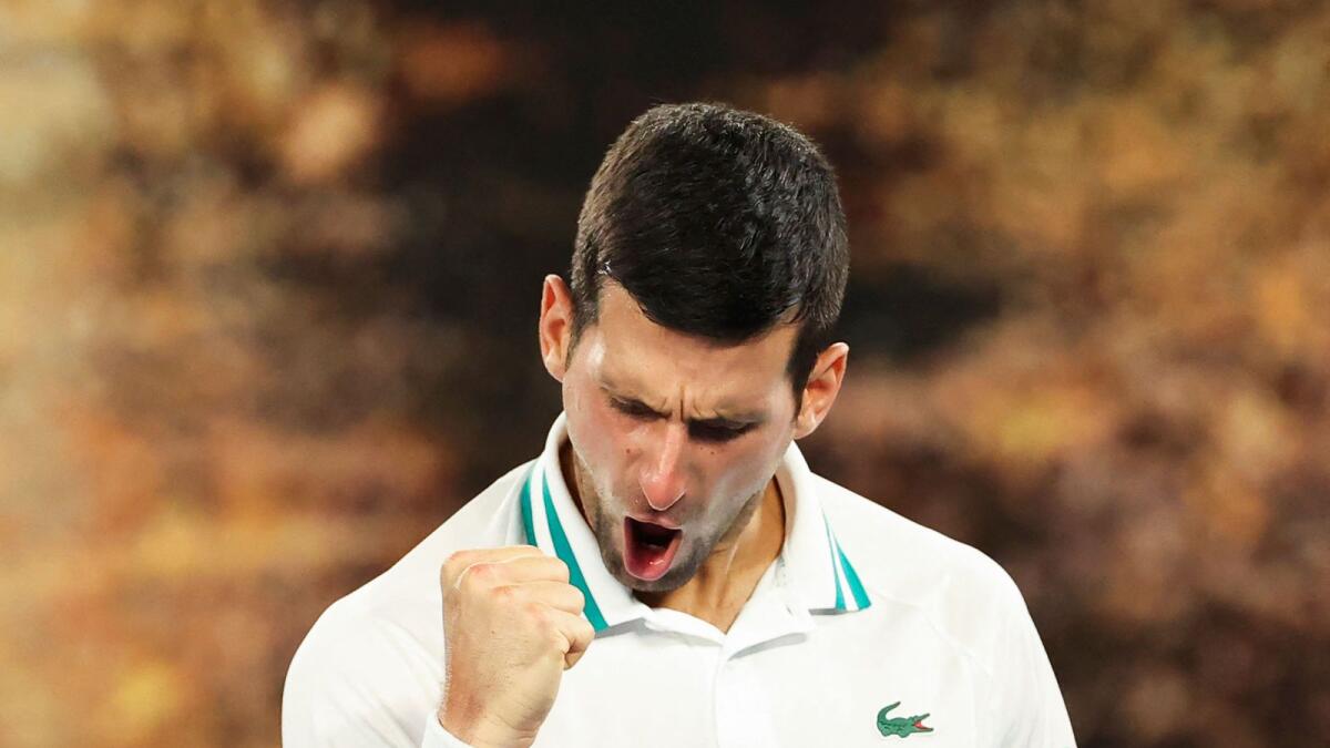 Serbia's Novak Djokovic celebrates his victory against Russia's Aslan Karatsev. — AFP