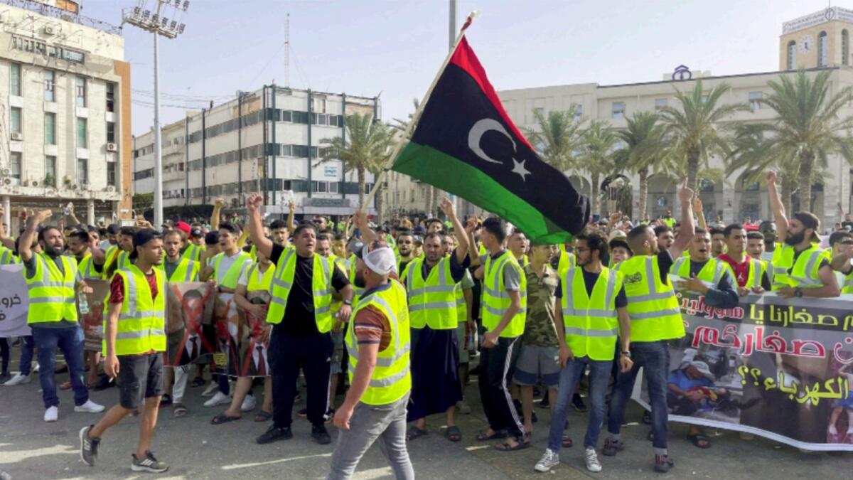 People protest against a power outage inside Martyrs' Square, in Tripoli. — Reuters