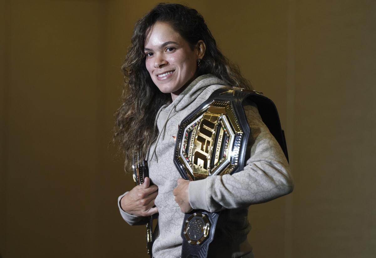Amanda Nunes is the current UFC Women's Featherweight Champion and two-time UFC Women's Bantamweight Champion.  AP.