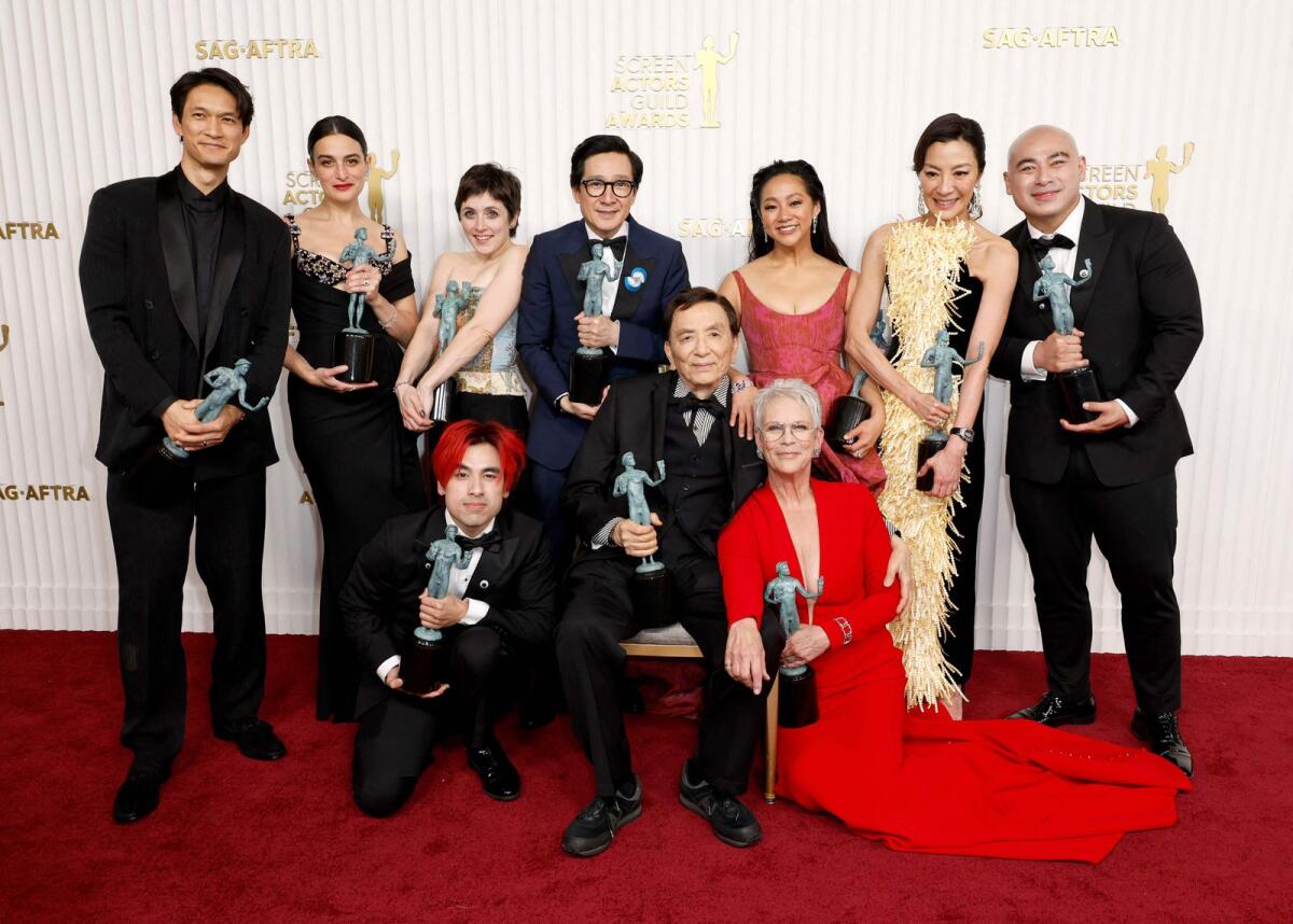Harry Shum Jr., Jenny Slate, Andy Le, Tallie Medel, Ke Huy Quan, James Hong, Stephanie Hsu, Jamie Lee Curtis, Michelle Yeoh and Brian Le, recipients of the Outstanding Performance by a Cast in a Motion Picture award for 'Everything Everywhere All at Once'