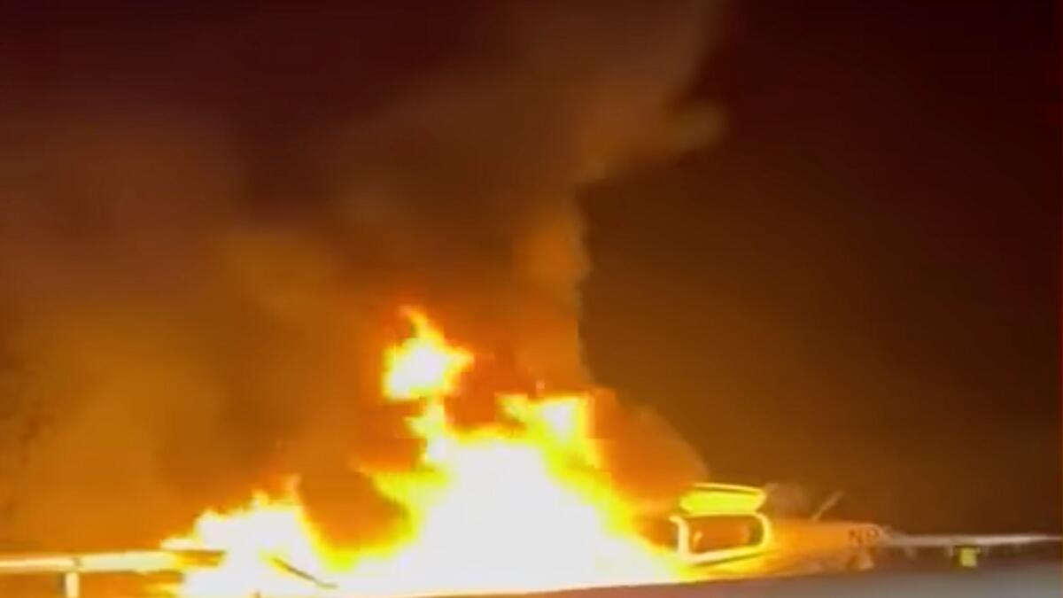 Screengrab from a video shared on social media shows a small plane on fire on Interstate 26 near Asheville Regional Airport.