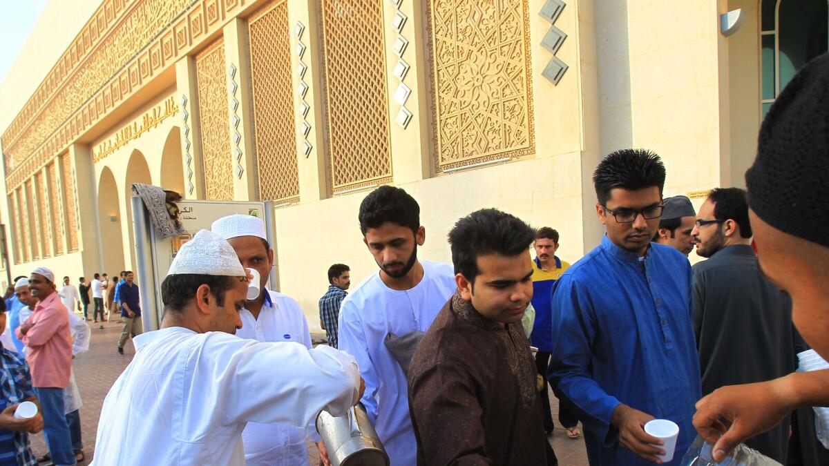 People greet each other after offering prayers at Al Karama Mosque in Dubai. Photo by Neeraj Murali/Khaleej Times