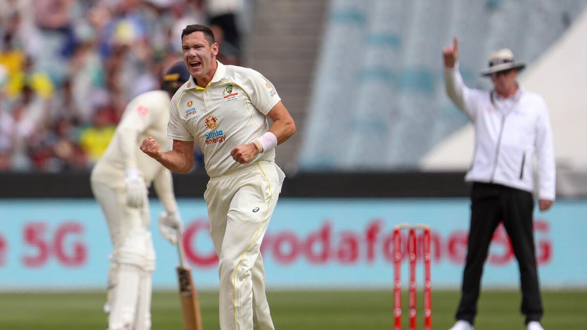 Australia's Scott Boland celebrates taking the wicket of England's Mark Wood. (AP)