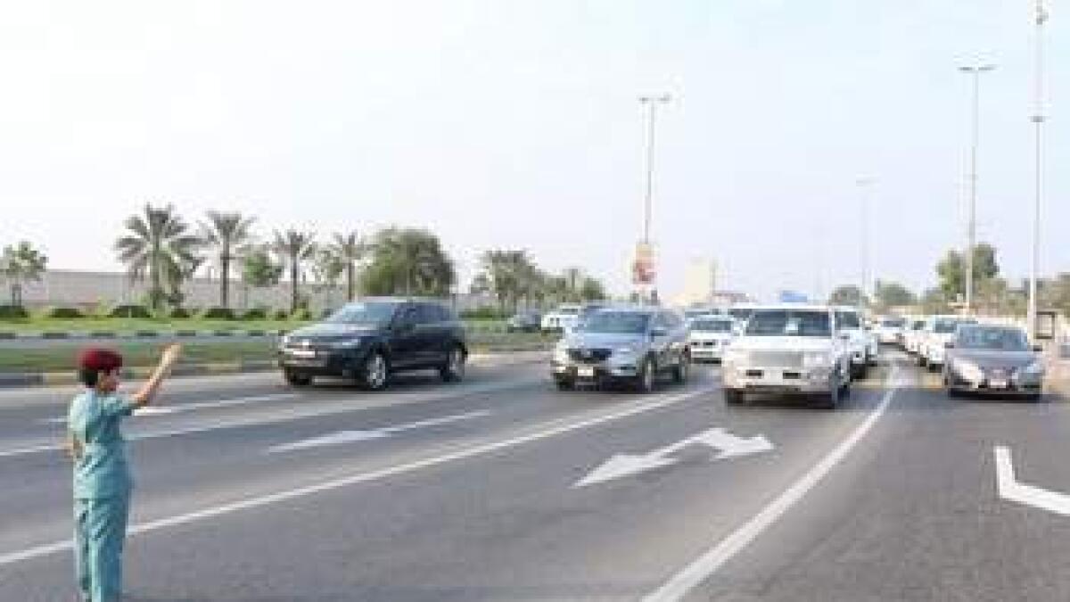 7-year-old Emirati boy mans traffic on UAE road
