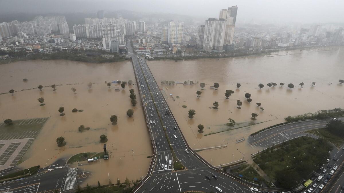 A riverside park near the Taehwa River is flooded by heavy rain caused by Typhoon Haishen in Ulsan. A powerful typhoon lashed South Korea after smashing into southern Japan with record winds and heavy rains that left four people missing in a landslide. Photo: AFP