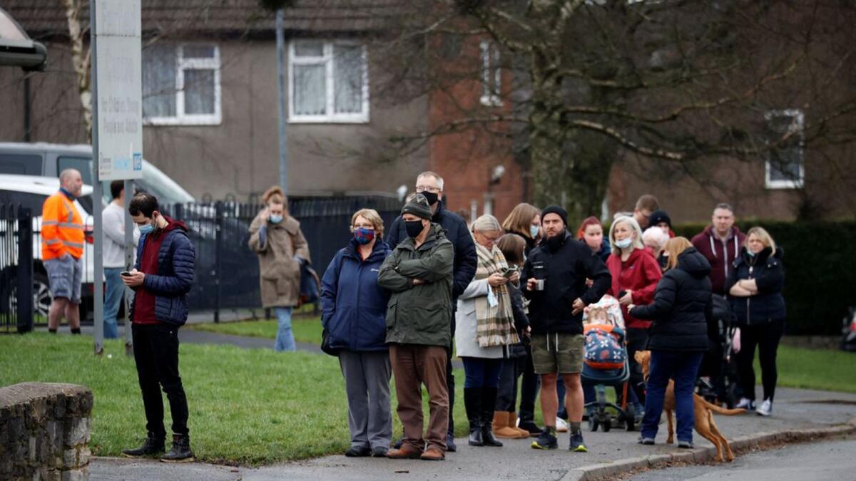 People queue outside a coronavirus disease vaccination centre at St Thomas's Hospital in London. – Reuters