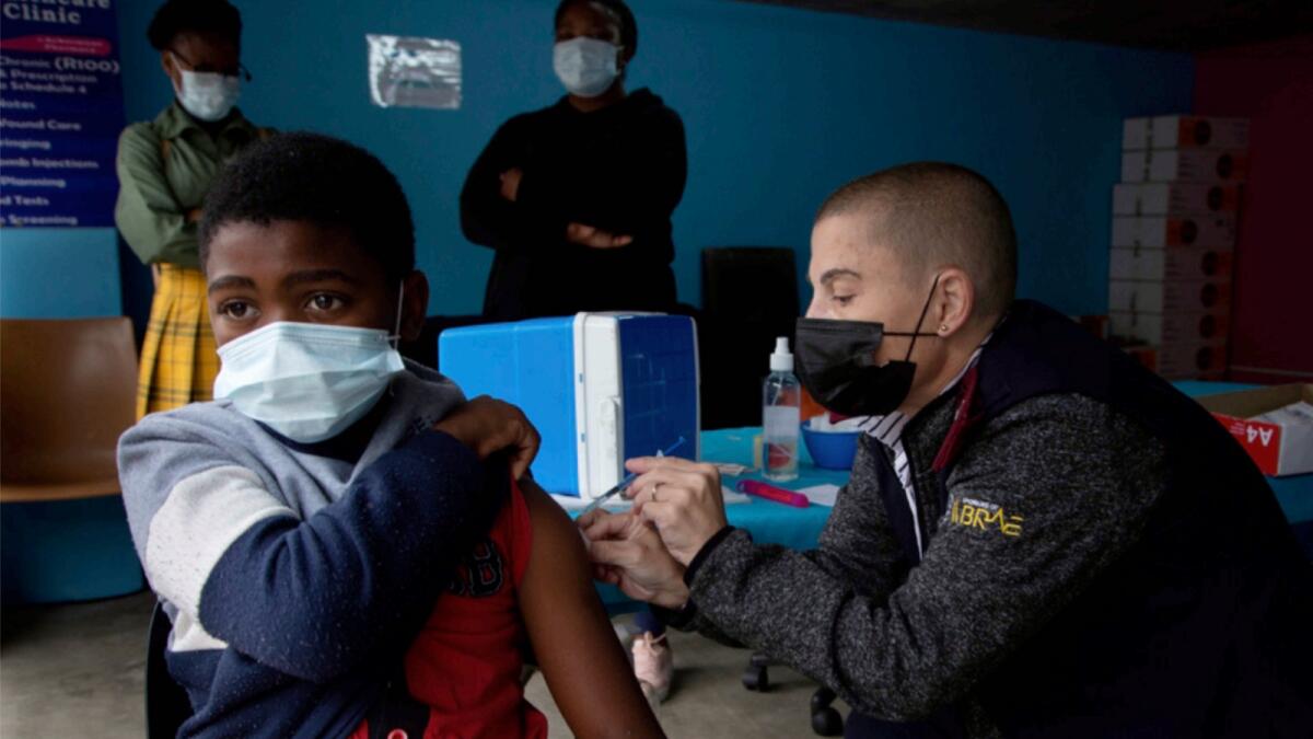 A boy gets vaccinated against Covid-19 at a site near Johannesburg. — AP
