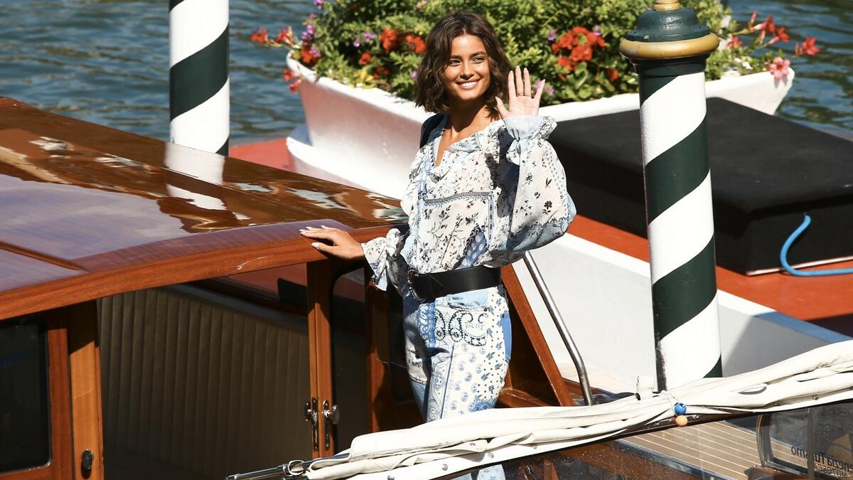 Model Taylor Hill poses for photographers upon arrival at the 77th edition of the Venice Film Festival in Venice, Italy. Photo: AP