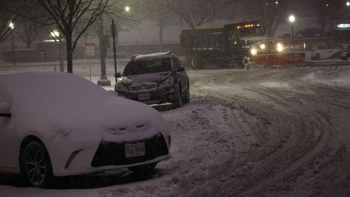 A snowplow cleans up snow in Washington, DC. -AFP