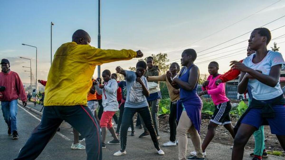 Athletes exercise amid the coronavirus disease (COVID-19) outbreak along the highway flyover in Kondele estate of Kisumu, western Kenya May 21, 2020.