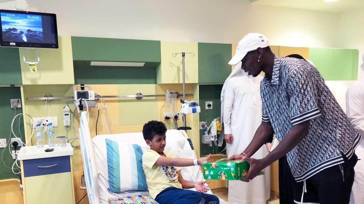 Paul Pogba met patients at AJCSH where he presented them with gifts and posed for photographs. — Supplied photo