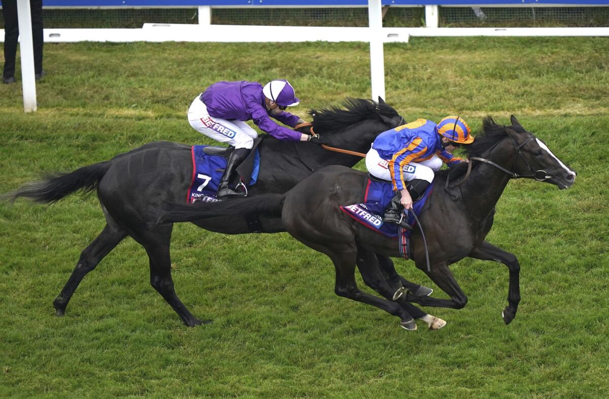 Champion jockey Ryan Moore drives Auguste Rodin to victory over King Of Steel and Kevin Scott in the English Derby (G1) at Epsom Racecourse on Saturday. - AP