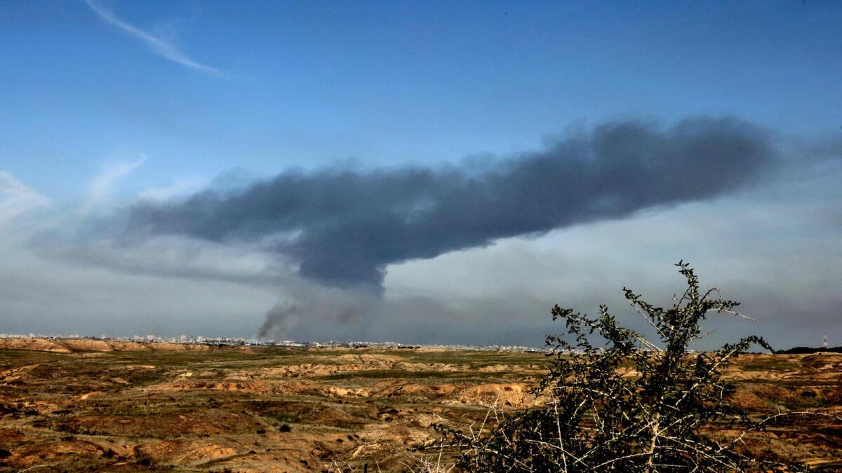 A picture taken in southern Israel near the border with the Gaza Strip shows smoke billowing following Israeli bombardment in the Palestinian territory. — AFP