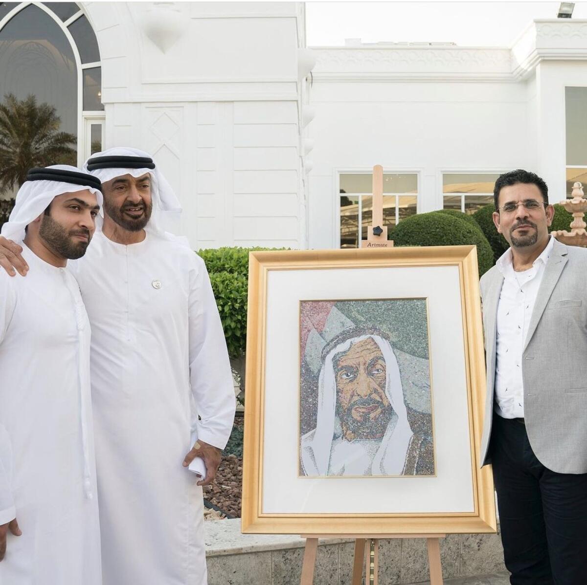 Sheikh Mohamed with Mohammed Abdullatif Galadari, co-chairman of Galadari Brothers, and KT illustrator Emadeldin Abdelsalam when they presented him with a portrait.