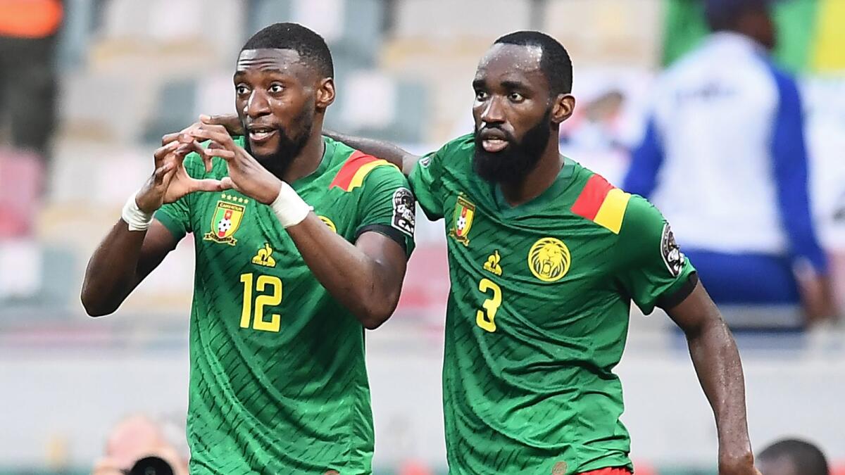 Cameroon's forward Karl Toko Ekambi (left) celebrates with Moumi Ngamaleu after scoring his team's first goal. (AFP)