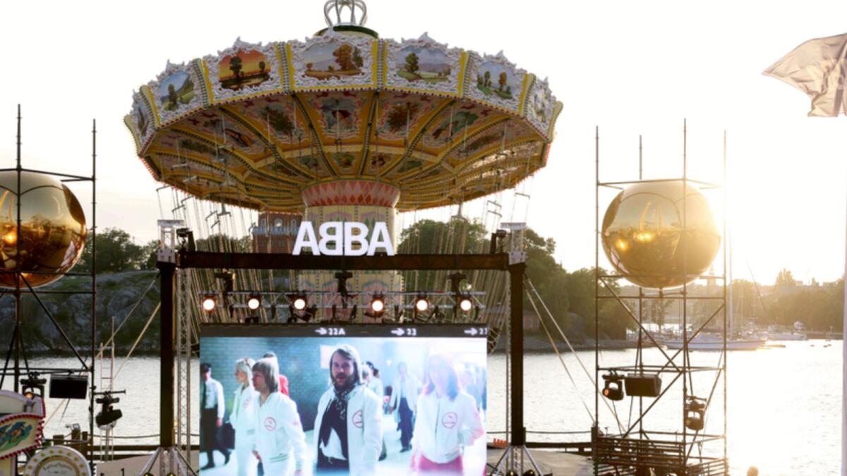 People watch the  ABBA Voyage event at Grona Lund, in Stockholm. — AP