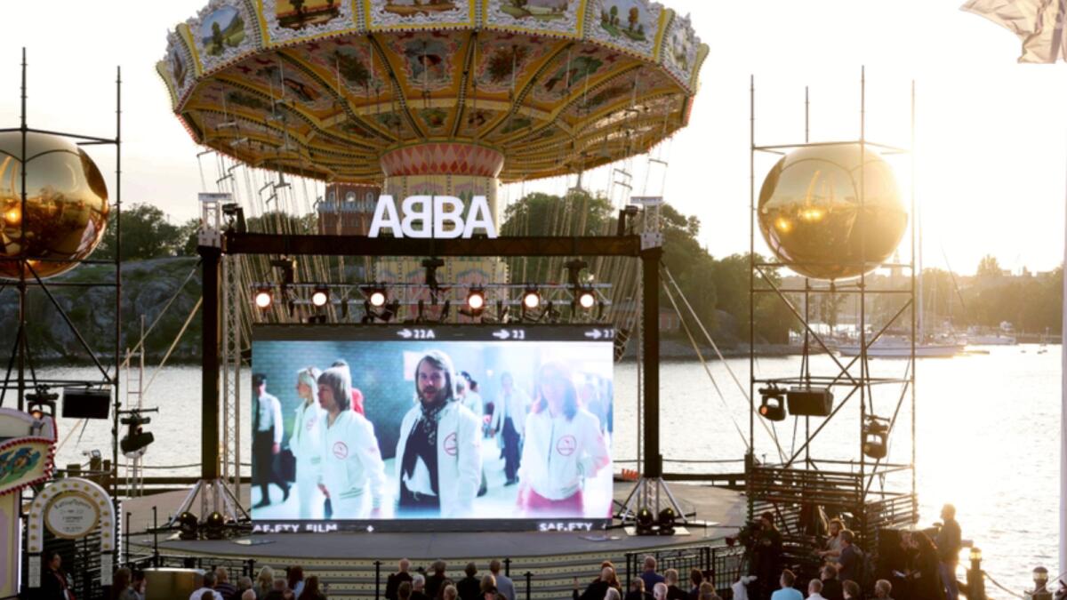 People watch the  ABBA Voyage event at Grona Lund, in Stockholm. — AP