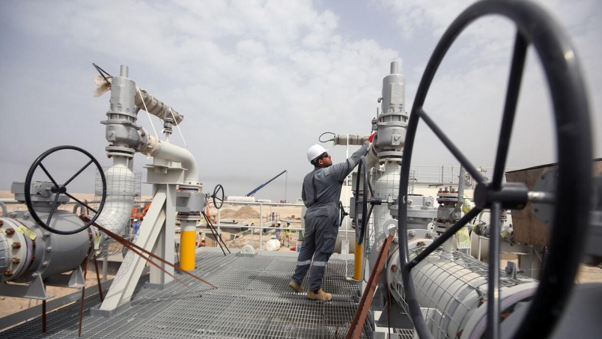 A worker is seen at Iraq's Majnoon oilfield near Basra. Brent was last trading at $93.02 per barrel, up 0.71 per cent while WTI was 0.3 per cent up at $86.87 a barrel. — Reuters file photo