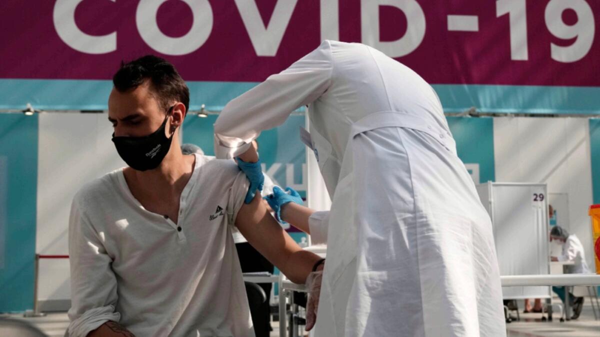 A medical worker administers a shot of Russia's Sputnik V coronavirus vaccine at a vaccination centre in Moscow. — AP file