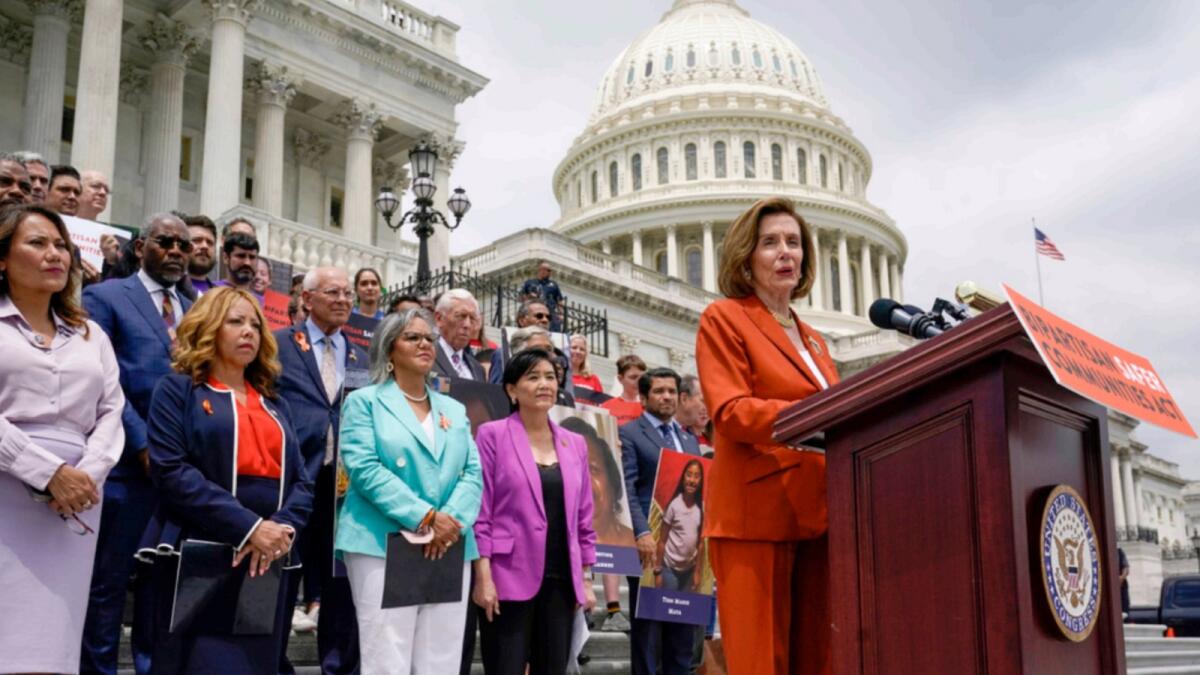House Speaker Nancy Pelosi and other lawmakers speak about the gun violence bill at the Capitol in Washington. — AP