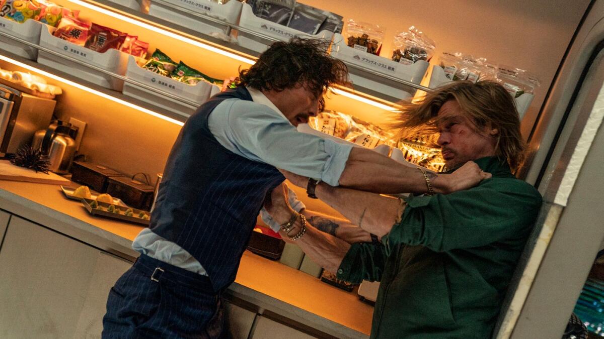 Aaron Taylor-Johnson and Brad Pitt in a scene from Bullet Train.